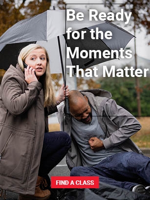 person holding umbrella over ill man