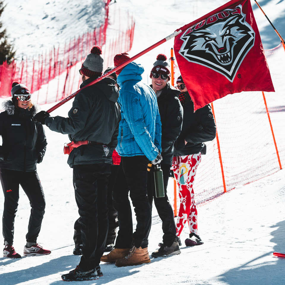 college students watching skiing