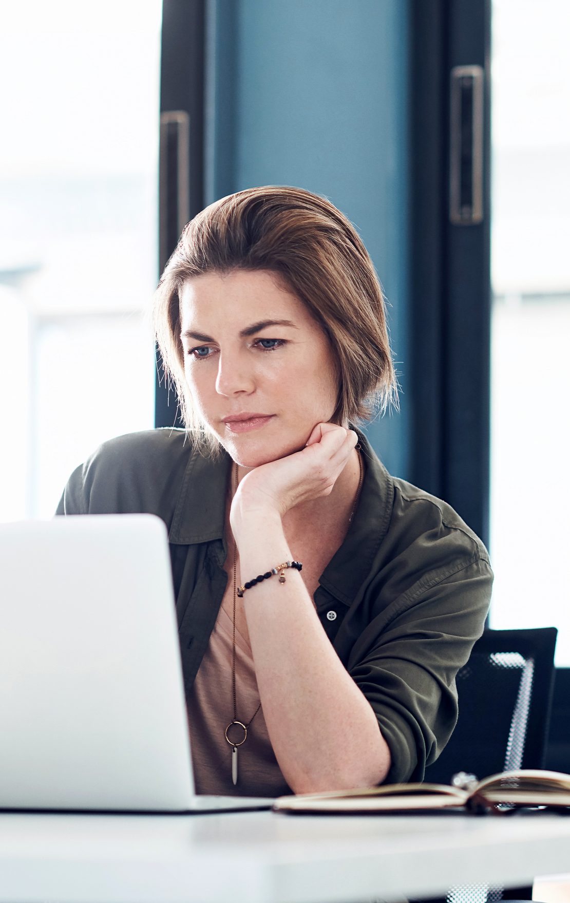 woman concentrating on a laptop screen