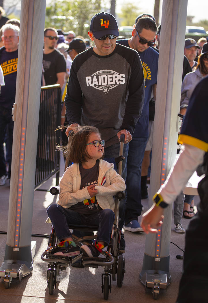 Fans pass security to enter before the Las Vegas Aviators home opener on Tuesday, April 9, 2019 ...