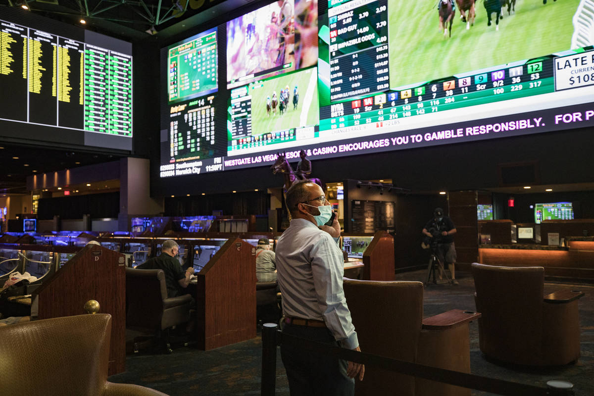 Jay Kornegay, vice president of Westgate Sportsbook, makes a phone call on the first day of the ...