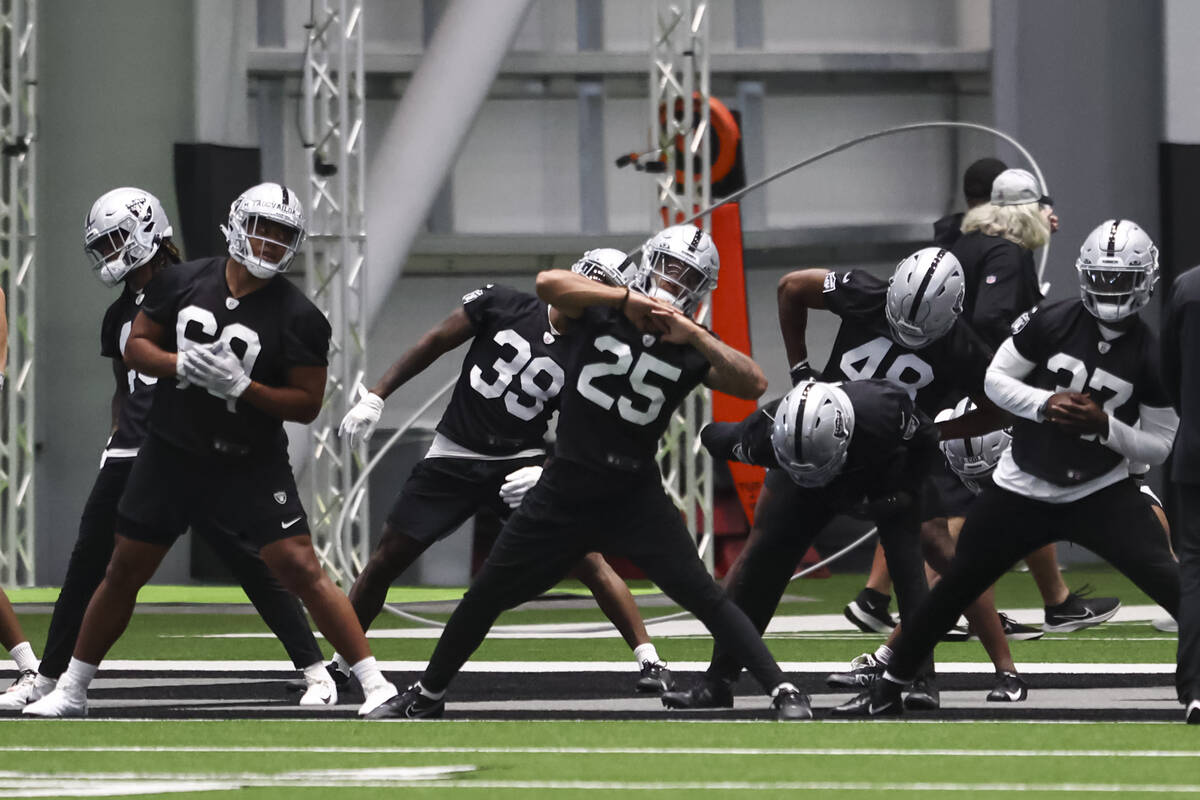 Raiders safety Tre’von Moehrig (25) stretches during minicamp training at Raiders Headqu ...