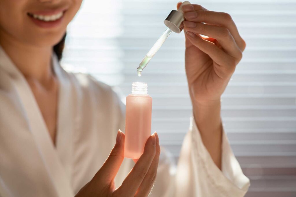 cropped of woman holding bottle with serum 2023 11 27 05 35 52 utc