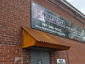 Corrugated corten rusted roof panel installation - view 6