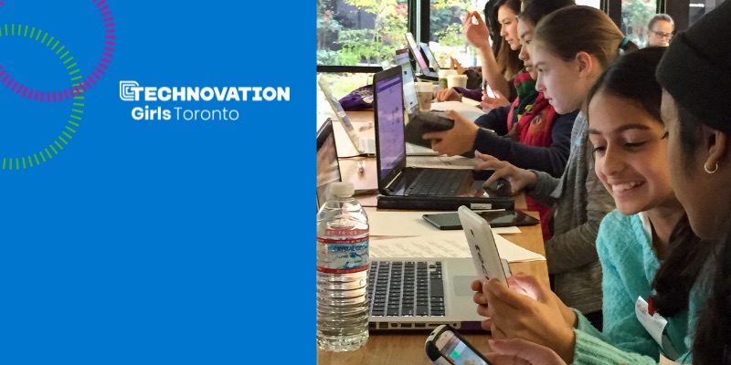 6 young girls looking happy as they work together at their laptops and cell phones on projects