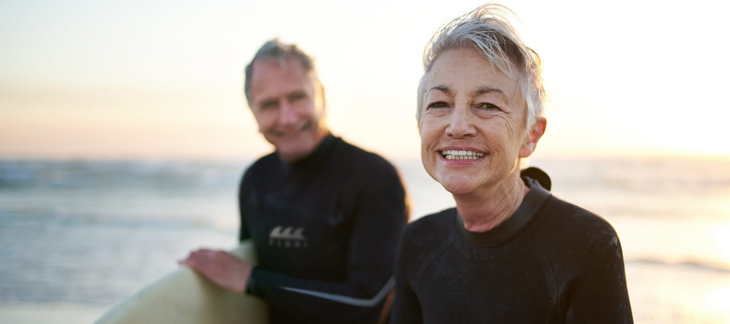 Senior married couple coming from surfing