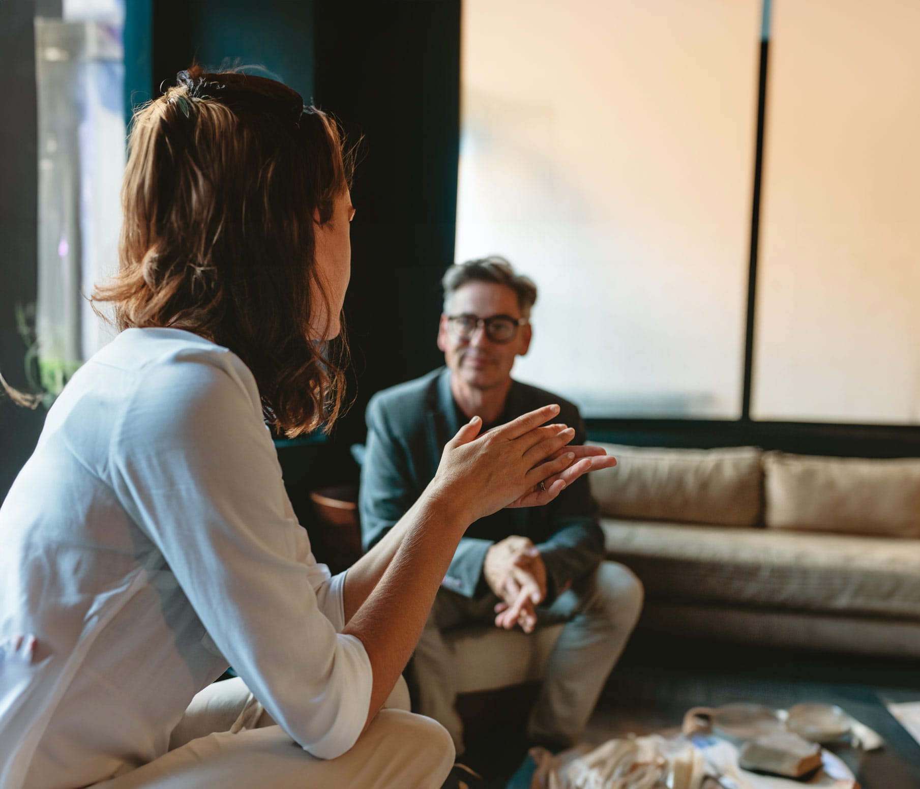 A man and woman sat talking