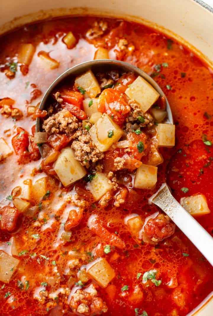 close-up of a pot of easy hamburger soup with a ladle