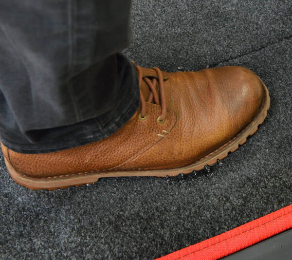 Sanistride shoe disinfecting mat insert that dispenses sanitizer added by customer to bottom of shoes thoroughly saturating the germs on shoe bottoms