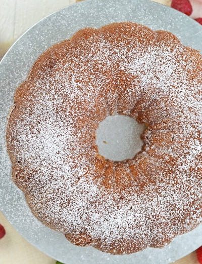 overhead of sour cream pound cake with powdered sugar dusting