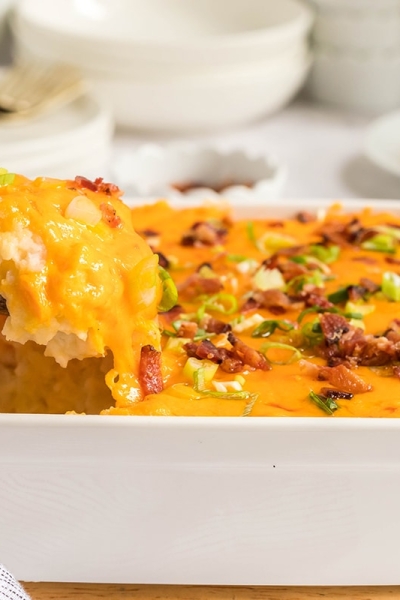 spoon in dish of twice baked potato casserole