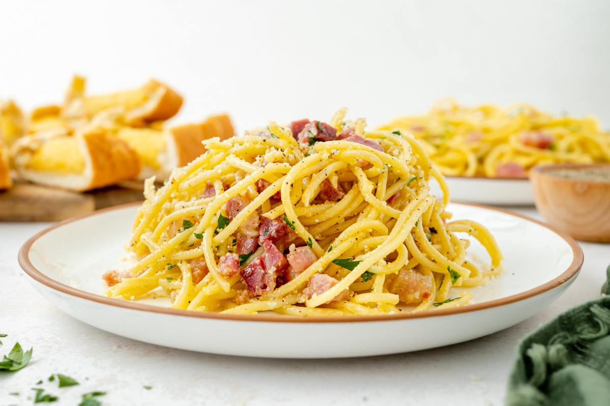 straight on shot of pile of carbonara on plate