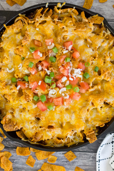 overhead of frito pie in a cast iron skillet