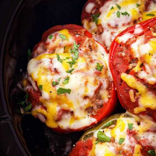 overhead closeup view of stuffed pepper in black crockpot