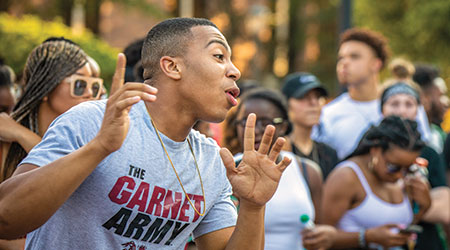 Group of students dancing on Greene Street.