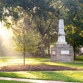 maxcy monument on horseshoe with sun shining through