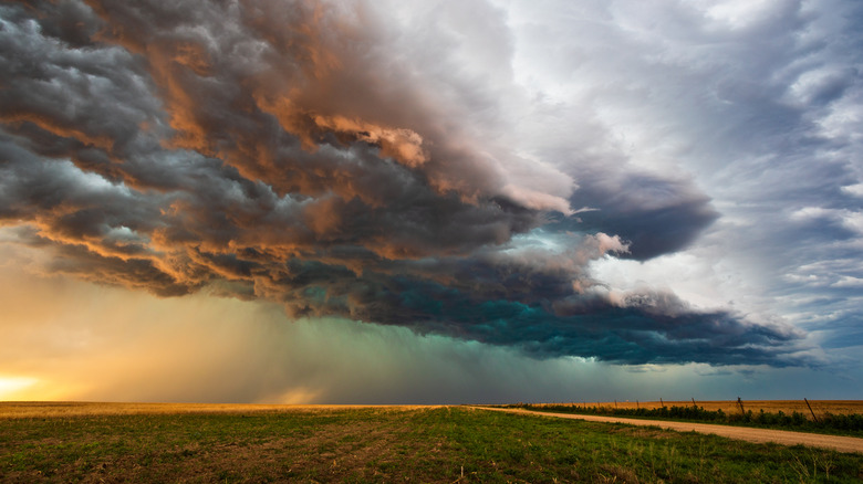 storm clouds on the horizon of a field