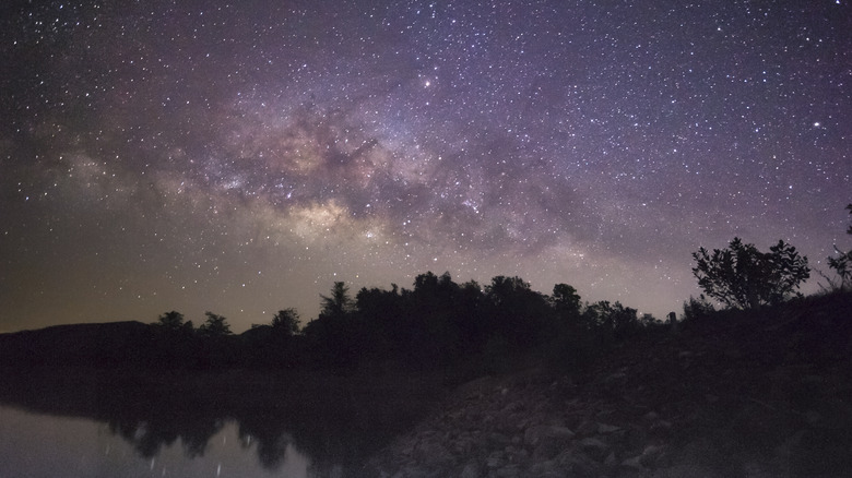 Milky way galaxy rise on lake