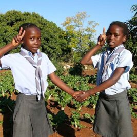 two girls salute