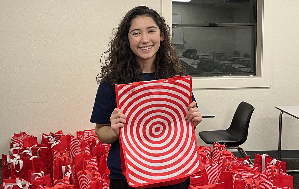 Claire Alford holding hygiene kit in target bag