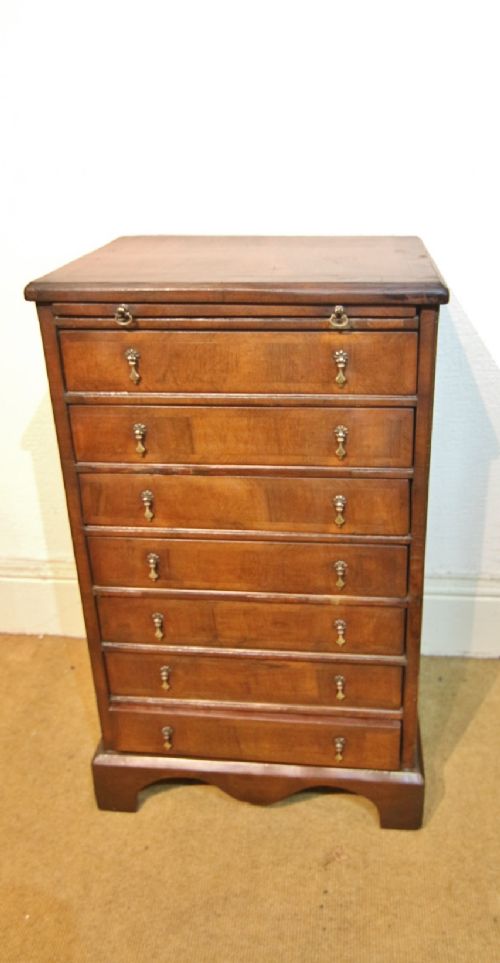 NARROW WALNUT COLLECTORS CHEST OF DRAWERS