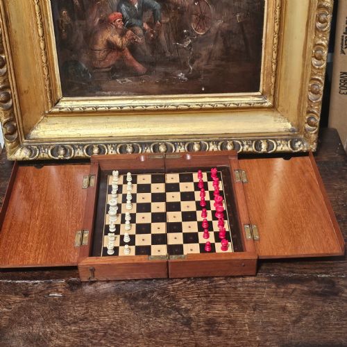 LATE VICTORIANEDWARDIAN MAHOGANY AND IVORY TRAVELLING CHESS SET