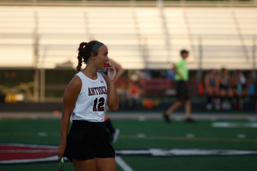 Junior Vera Fogel putting in her mouthguard.