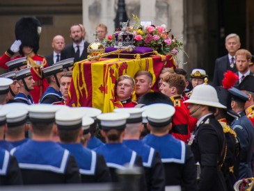 LONDON, ENGLAND - SEPTEMBER 19: The coffin of Queen Elizabeth II is placed on a gun carriage during the State Funeral of Queen Elizabeth II at Westminster Abbey on September 19, 2022 in London, England. Elizabeth Alexandra Mary Windsor was born in Bruton Street, Mayfair, London on 21 April 1926. She married Prince Philip in 1947 and ascended the throne of the United Kingdom and Commonwealth on 6 February 1952 after the death of her Father, King George VI. Queen Elizabeth II died at Balmoral Castle in Scotland on September 8, 2022, and is succeeded by her eldest son, King Charles III.