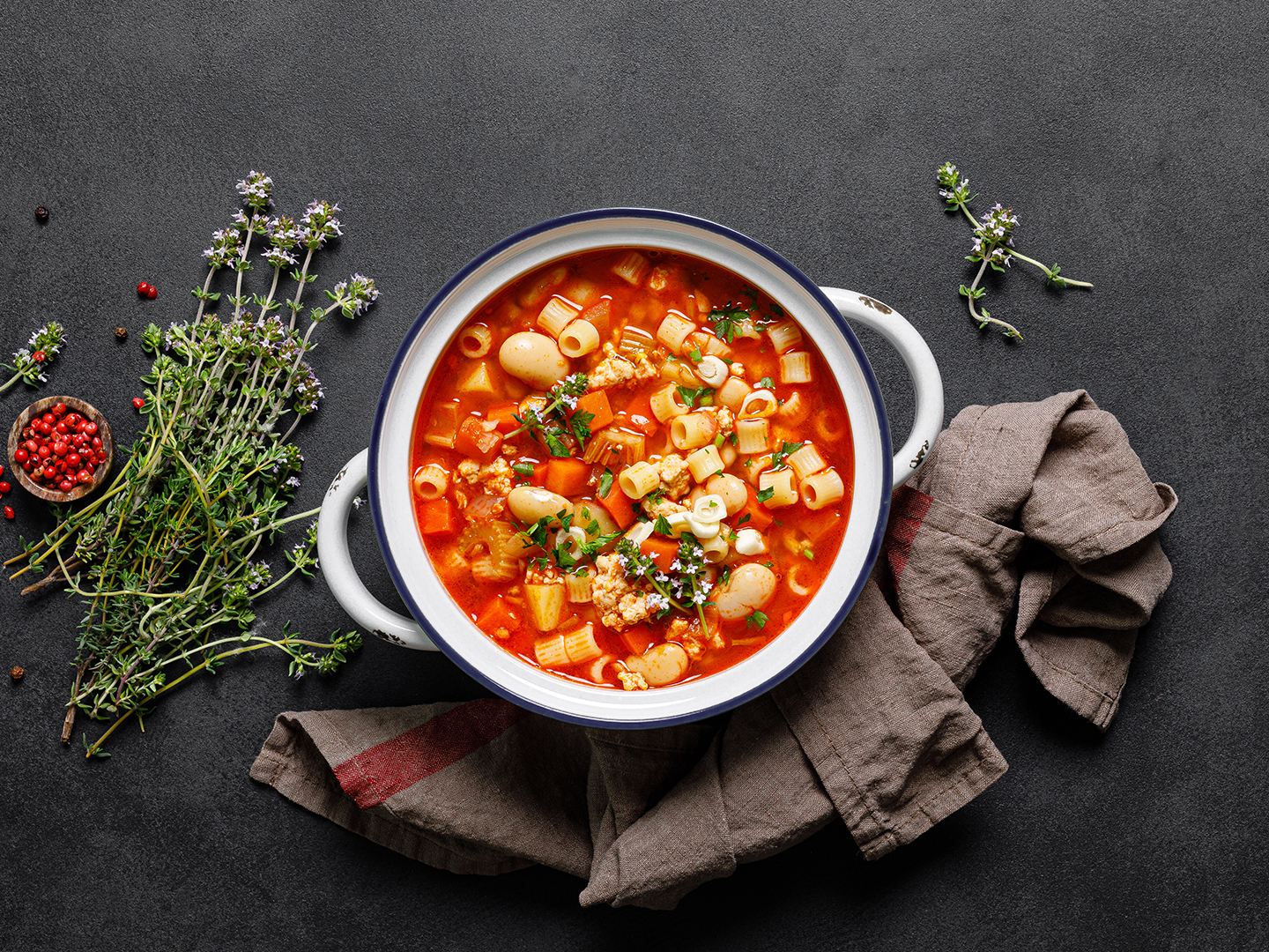 Cooking pasta e fagioli soup with chicken meat and vegetables, italian cuisine