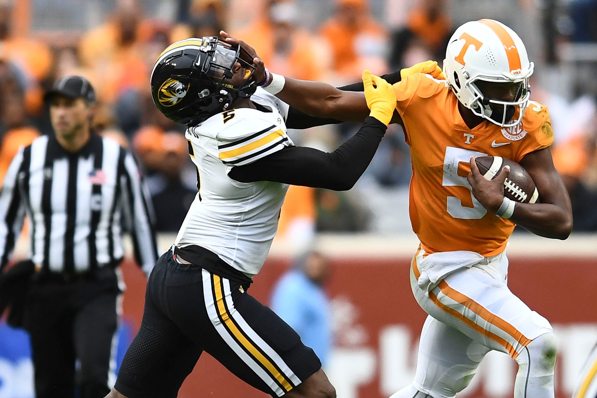 Hendon Hooker (5) tries to hold back Missouri defensive lineman Tyrone Hopper II (5) during an NCAA college football game on Saturday, November 12, 2022 in Knoxville, Tenn. Ut Vs Missouri