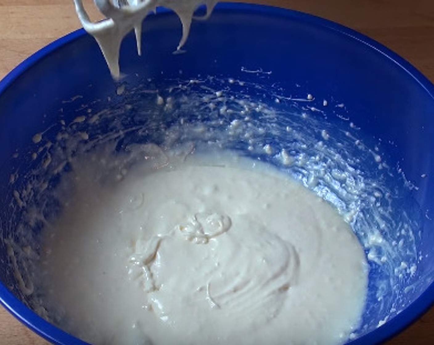 step 2 In a large mixing bowl, add room-temperature Cream Cheese (1/2 cup), Vanilla Extract (1 tsp), Powdered Confectioners Sugar (2 Tbsp), and the cooled chocolate mixture. Beat together with a hand mixer.