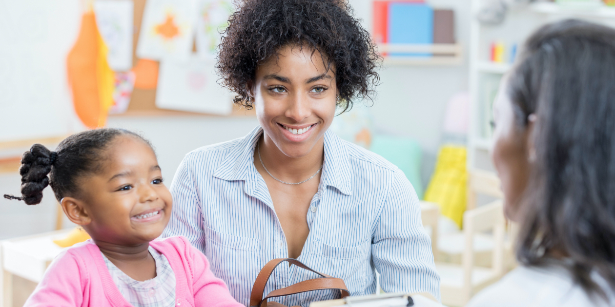 mom and daughter meeting with teacher