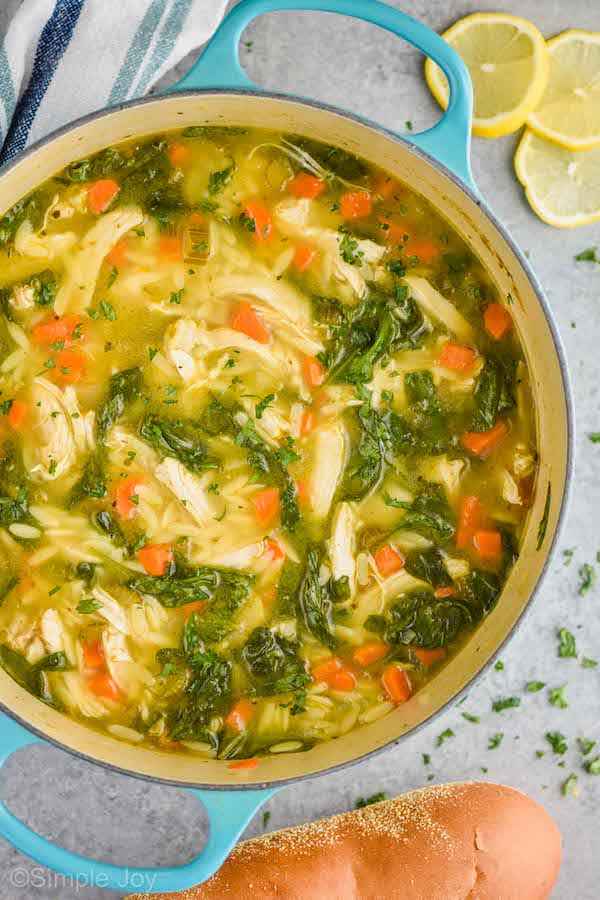 overhead of a pot of lemon chicken orzo soup