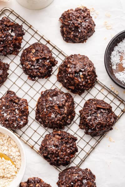 Overhead view of no-bake chocolate cookies on wire rack and countertop