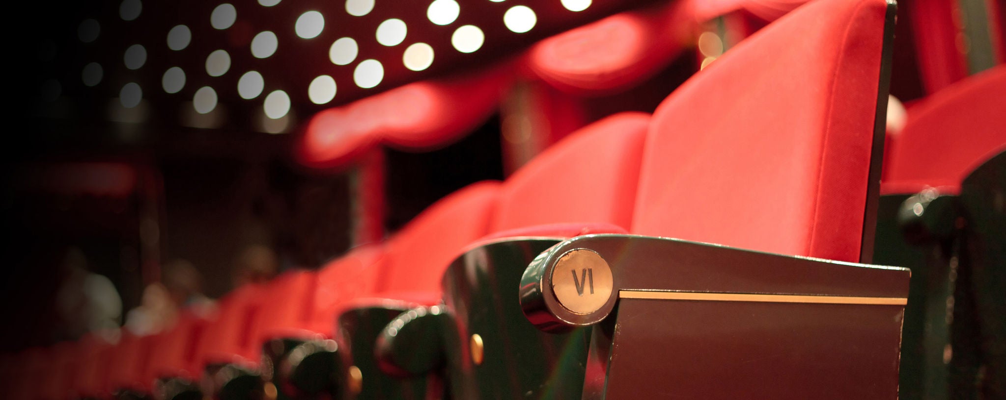 Row of red theater seats.