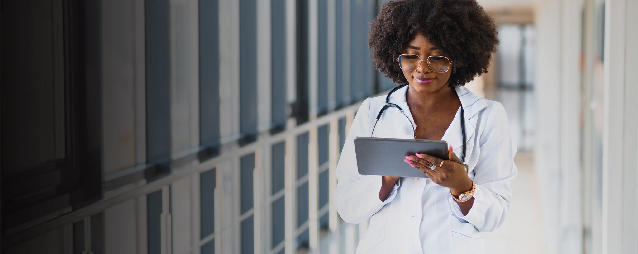 Doctor looking at tablet in a hospital