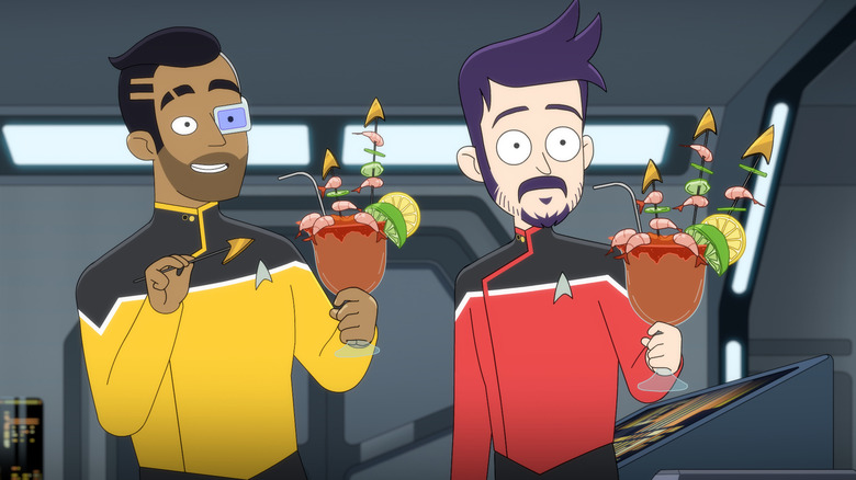 Eugene Cordero as Rutherford and Jack Quaid as Boimler holding drinks in Star Trek: Lower Decks