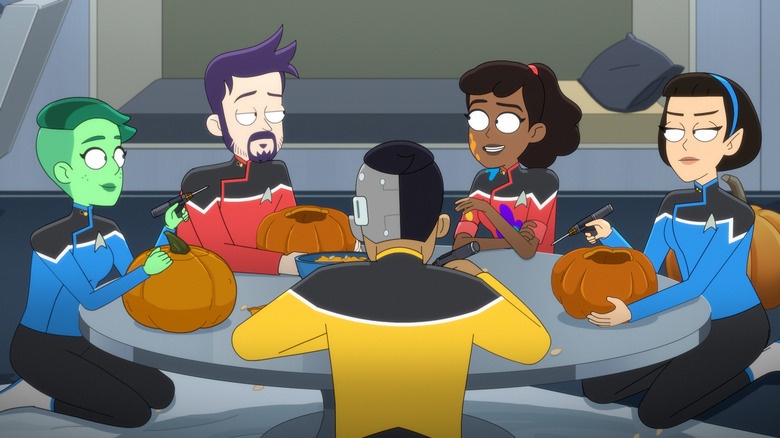 Jack Quaid as Boimler, Tawny Newsome as Mariner, and the rest of the crew sitting around a table in Star Trek: Lower Decks