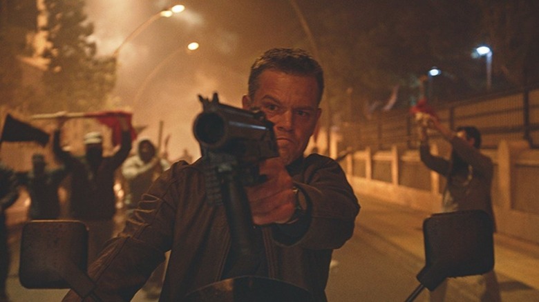 Jason Bourne pointing gun