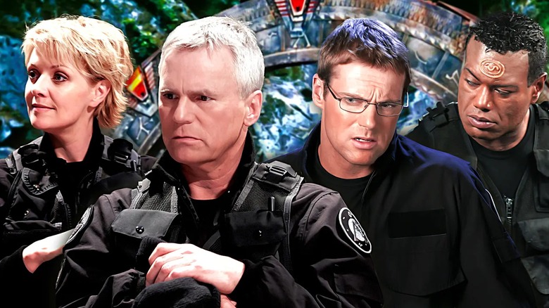 Amanda Tapping, Richard Dean Anderson, Michael Shanks, and Christopher Judge in Stargate attire, standing in front of a Stargate