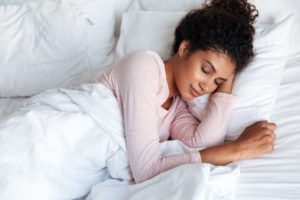 A woman enjoying sleep in the morning light