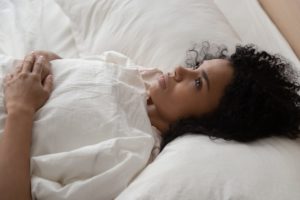 woman lying awake in bed