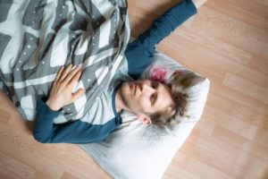 Man sleeping on floor