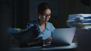 Woman working late at night