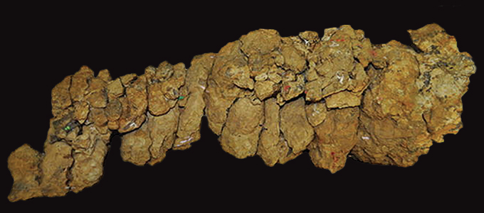 A photo of a pile of rocks on a black background.