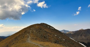 view of Wheeler Peak NM under blue sky with cloud