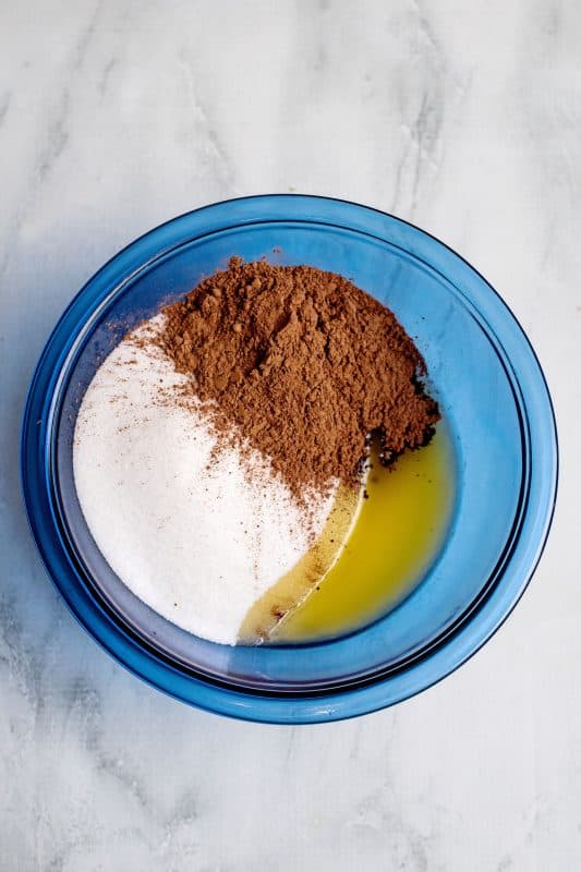 In a separate medium bowl, place melted butter, sugar, and cocoa powder.