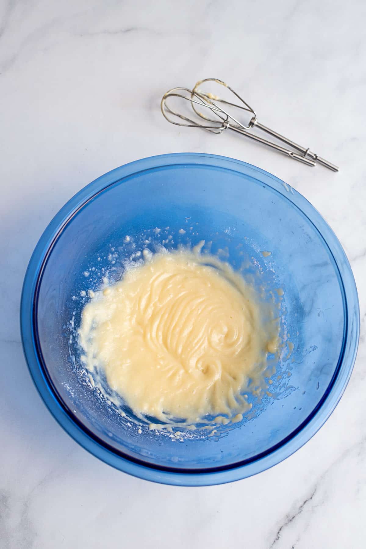 Pudding mix in blue mixing bowl