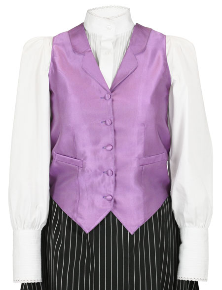 This well-appointed ladies vest is made of a finely woven satin fabric with micro stripes and is accented with white stitching, you’ll seem to sparkle subtly under the lights The vest is self-backed, features rounded lapels, and five fabric covered buttons to fasten up the front. Two inset waist pockets provide space for a lady’s must-haves such as a delicate hankie or silver compact. Adjustable ties in the back create a custom fit and pin tucks in the front create a flatering ladies silhouette. | Spur Western Wear