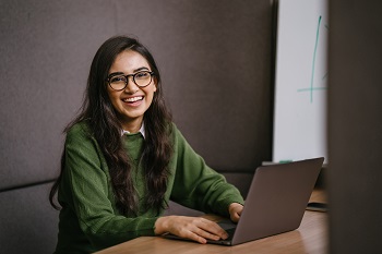 Female student using her laptop